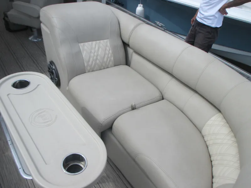 Slide: The Image of 2018 Premier 270 Intrigue RF boat interior with beige seating and table. - 8