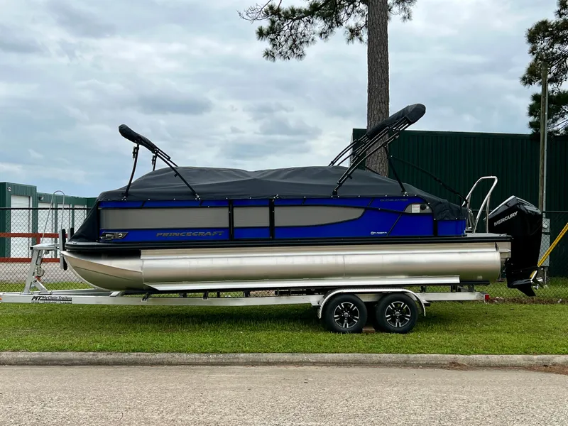 The Image of 2024 Princecraft Quorum 23 RL pontoon boat on a trailer. - 0