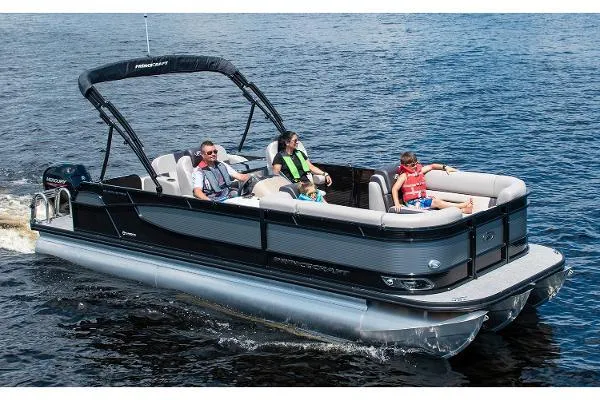 Slide: The Image of 2024 Princecraft Quorum 23 RL pontoon boat cruising on a lake with passengers. - 11