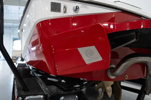 Slide: The Image of 2024 Axis Wake Research T220-R boat rear view in a showroom. - 12