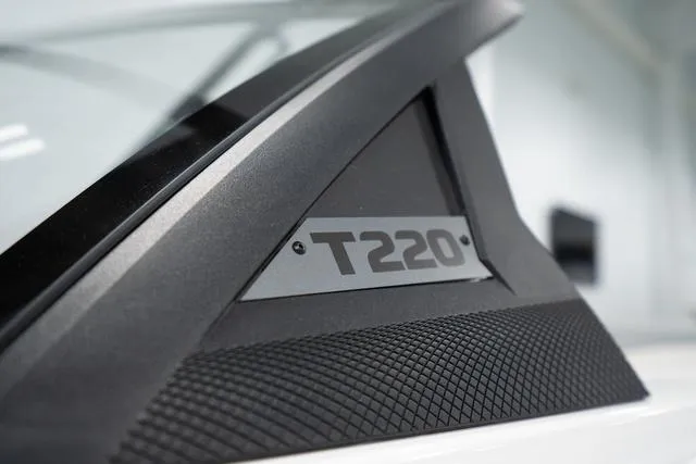 Slide: The Image of Close-up of 2024 Axis Wake Research T220-R boat model nameplate. - 13