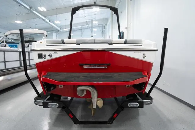 Slide: The Image of 2024 Axis Wake Research T220-R boat, rear view in showroom. - 3