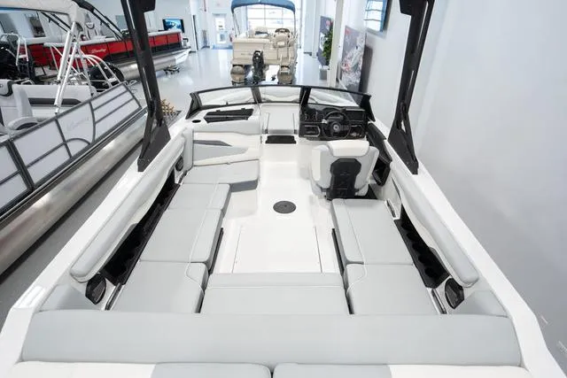 Slide: The Image of 2024 Axis Wake Research T220-R boat interior with spacious seating and modern design. - 4