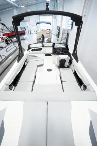 Slide: The Image of 2024 Axis Wake Research T220-R boat interior with modern seating and control panel. - 5