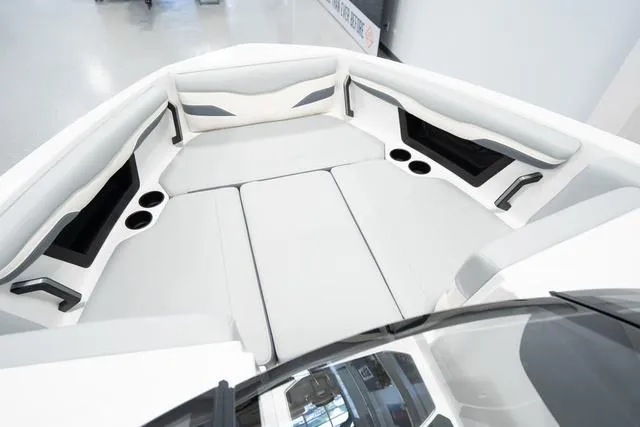 Slide: The Image of 2024 Axis Wake Research T220-R boat interior with white cushioned seating. - 8