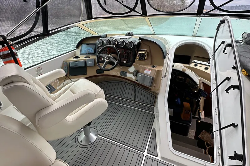 Slide: The Image of 2001 Carver 570 Voyager Pilothouse helm with modern navigation equipment and luxurious seating. - 22