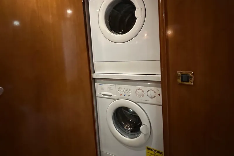 Slide: The Image of Stacked washer and dryer in 2001 Carver 570 Voyager Pilothouse yacht. - 25