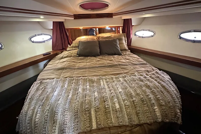 Slide: The Image of Luxurious bedroom in 2001 Carver 570 Voyager Pilothouse yacht. - 27