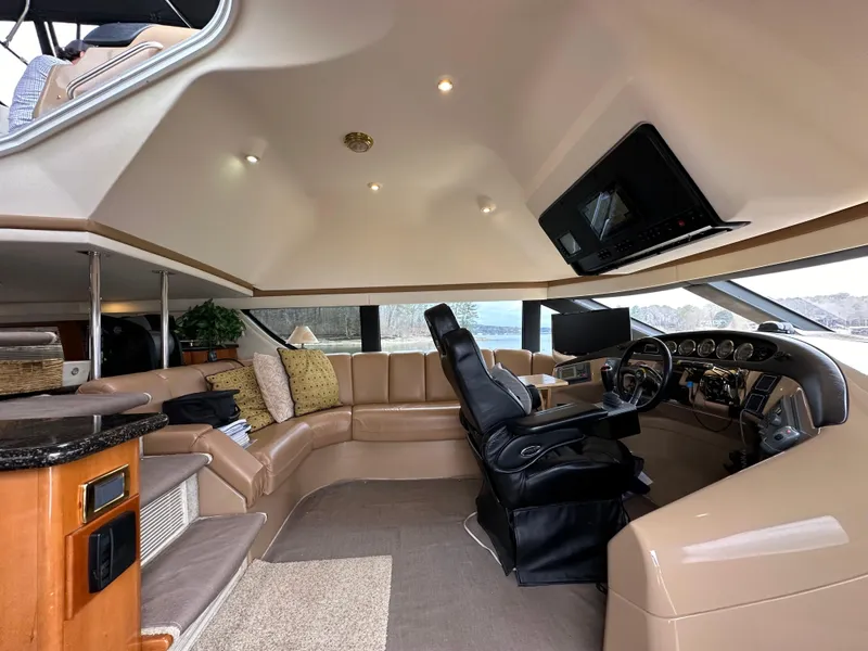 Slide: The Image of Luxurious interior of 2001 Carver 570 Voyager Pilothouse with leather seating and modern helm. - 14