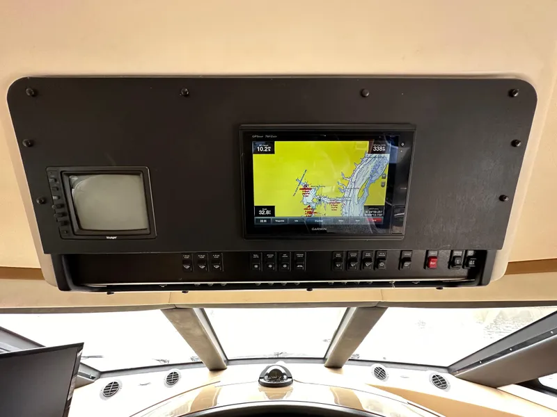 Slide: The Image of 2001 Carver 570 Voyager Pilothouse navigation system and control panel. - 15