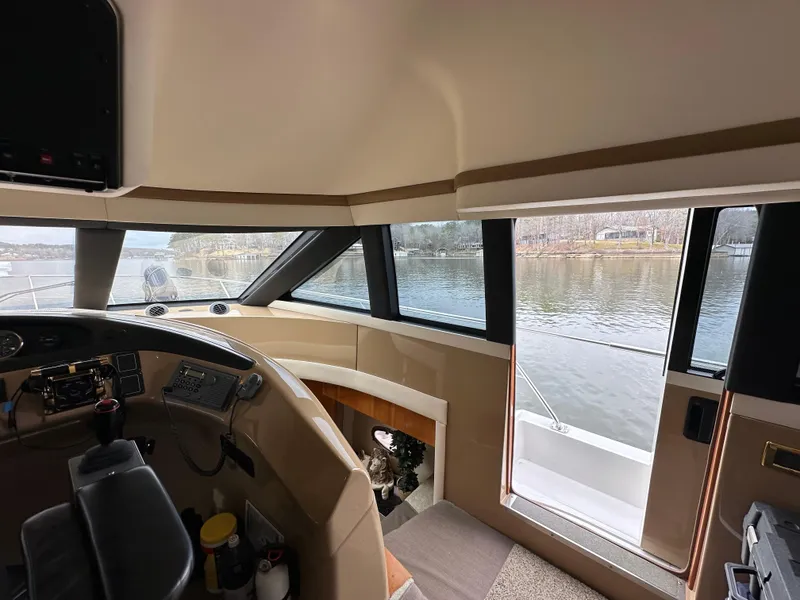 Slide: The Image of Interior view of 2001 Carver 570 Voyager Pilothouse with river scenery. - 16