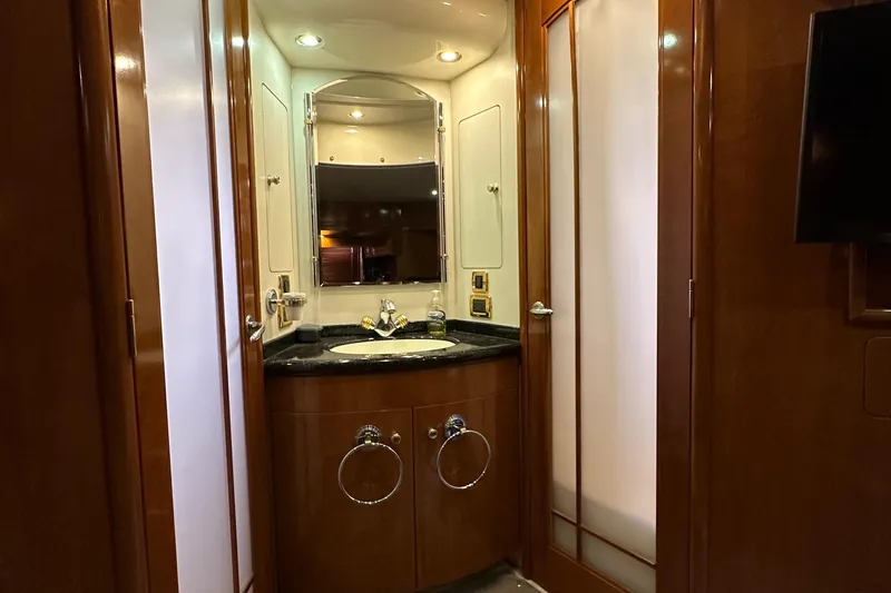 Slide: The Image of Luxurious bathroom in 2001 Carver 570 Voyager Pilothouse yacht with wooden cabinetry. - 24