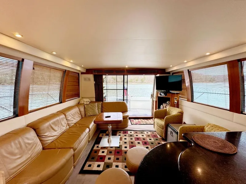 Slide: The Image of Luxurious interior of 2001 Carver 570 Voyager Pilothouse yacht with leather seating and modern decor. - 3