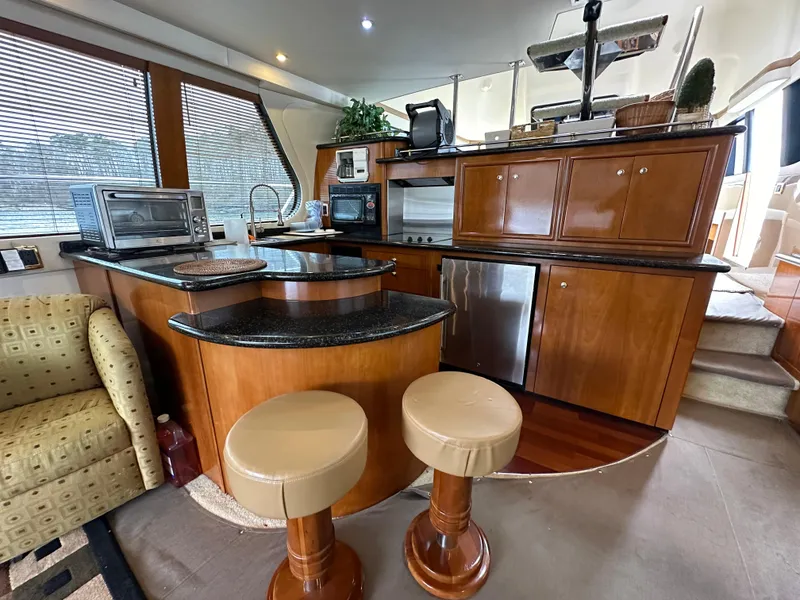 Slide: The Image of Luxurious kitchen area in 2001 Carver 570 Voyager Pilothouse yacht. - 8