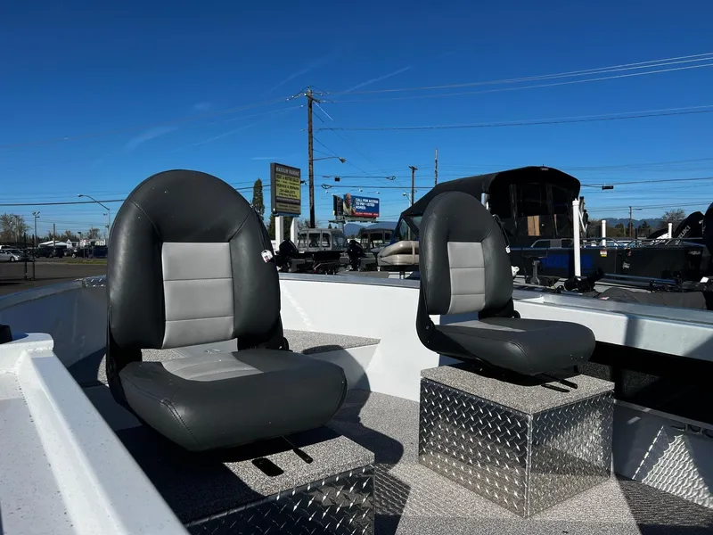 Slide: The Image of 2024 Fish Rite Angler 18 boat seats in outdoor showroom. - 11