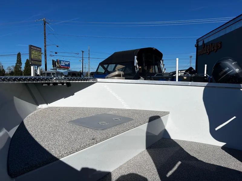 Slide: The Image of 2024 Fish Rite Angler 18 boat interior with seating and storage compartments. - 13