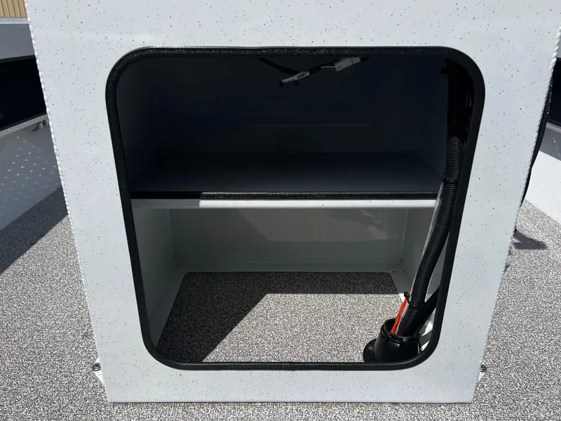 Slide: The Image of Open storage compartment on 2024 Fish Rite Angler 18 boat. - 19
