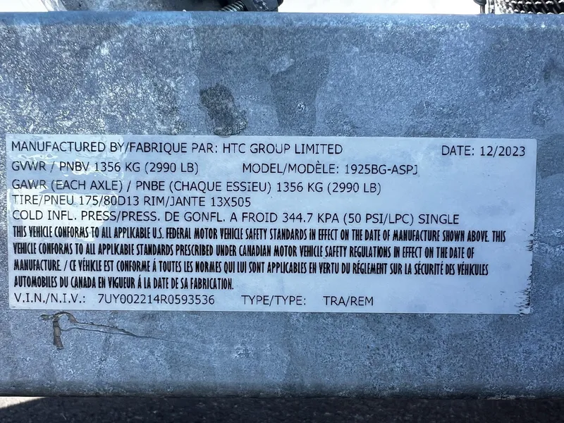 Slide: The Image of Fish Rite Angler 18 2024 trailer label with specifications and compliance details. - 23