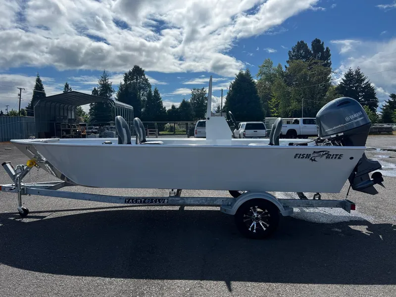 Slide: The Image of 2024 Fish Rite Angler 18 boat on trailer under cloudy sky. - 5