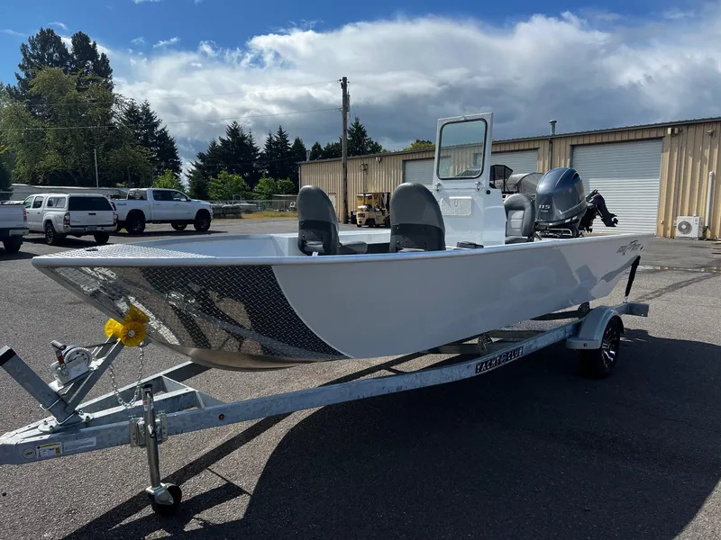 Slide: The Image of 2024 Fish Rite Angler 18 boat on a trailer in a parking lot. - 6