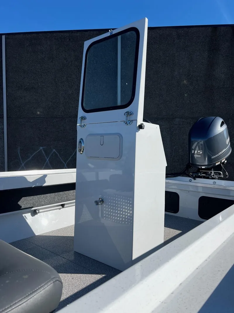 Slide: The Image of 2024 Fish Rite Angler 18 boat console and motor. - 9