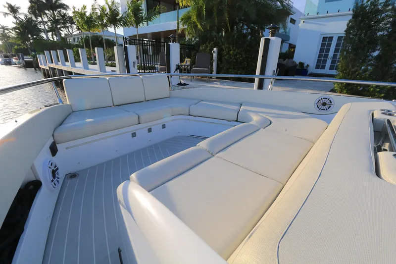 Slide: The Image of Luxurious seating area on 2022 Azimut 47 VERVE yacht, docked by waterfront property. - 11