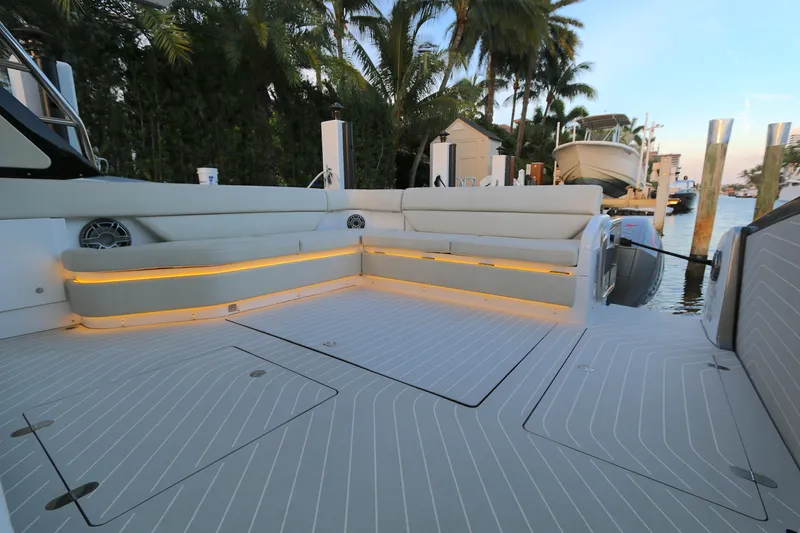 Slide: The Image of Luxurious 2022 Azimut 47 VERVE yacht deck with elegant seating and ambient lighting. - 16