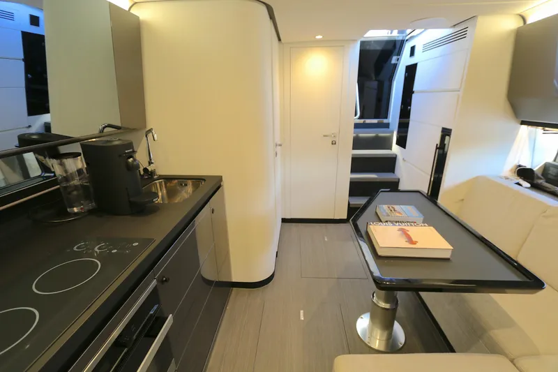 Slide: The Image of Luxurious interior of 2022 Azimut 47 VERVE yacht with modern kitchen and dining area. - 2