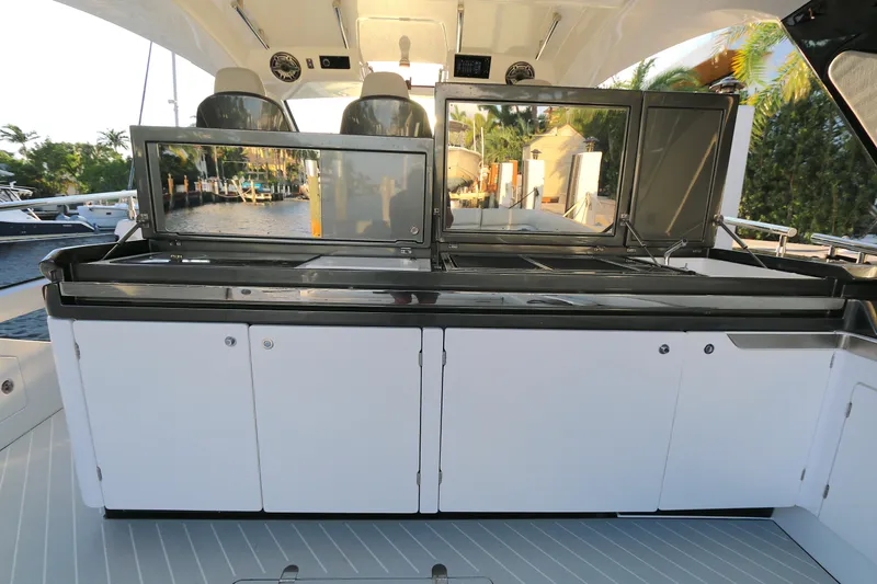 Slide: The Image of 2022 Azimut 47 VERVE yacht deck with sleek cabinetry and modern design. - 22