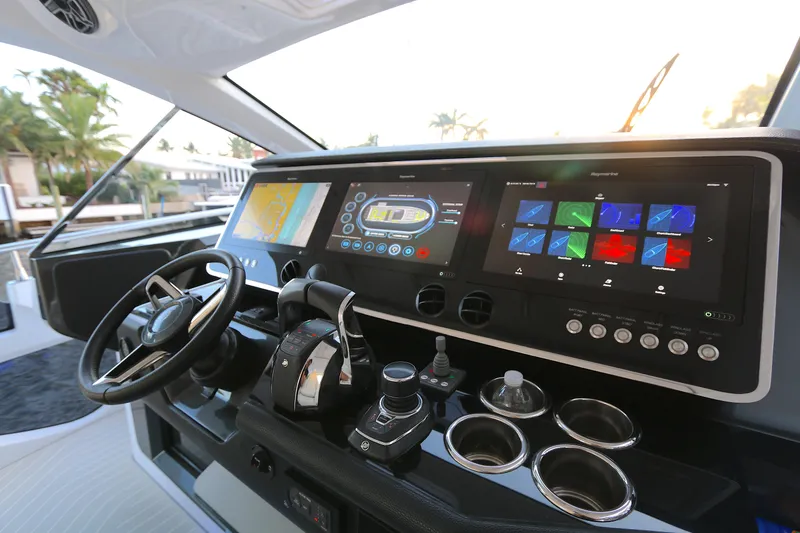 Slide: The Image of Helm of 2022 Azimut 47 VERVE yacht with advanced navigation controls and touchscreen displays. - 23