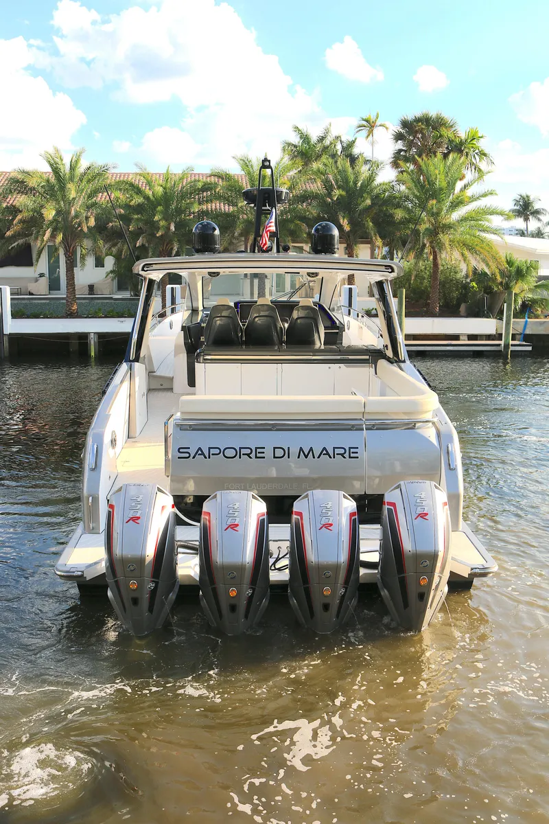 Slide: The Image of 2022 Azimut 47 VERVE luxury yacht with four powerful engines docked by palm trees. - 26