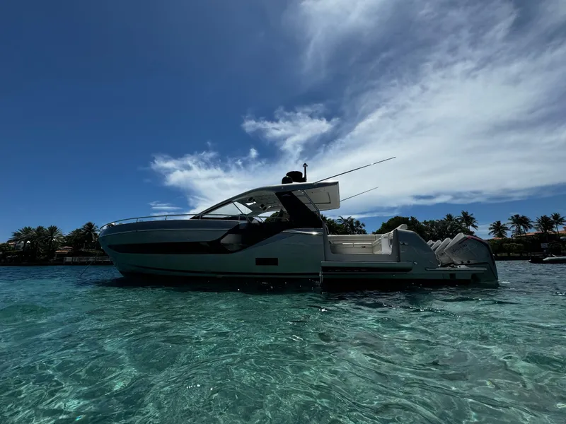 Slide: The Image of Azimut 47 VERVE 2022 yacht on clear tropical waters under a bright blue sky. - 27