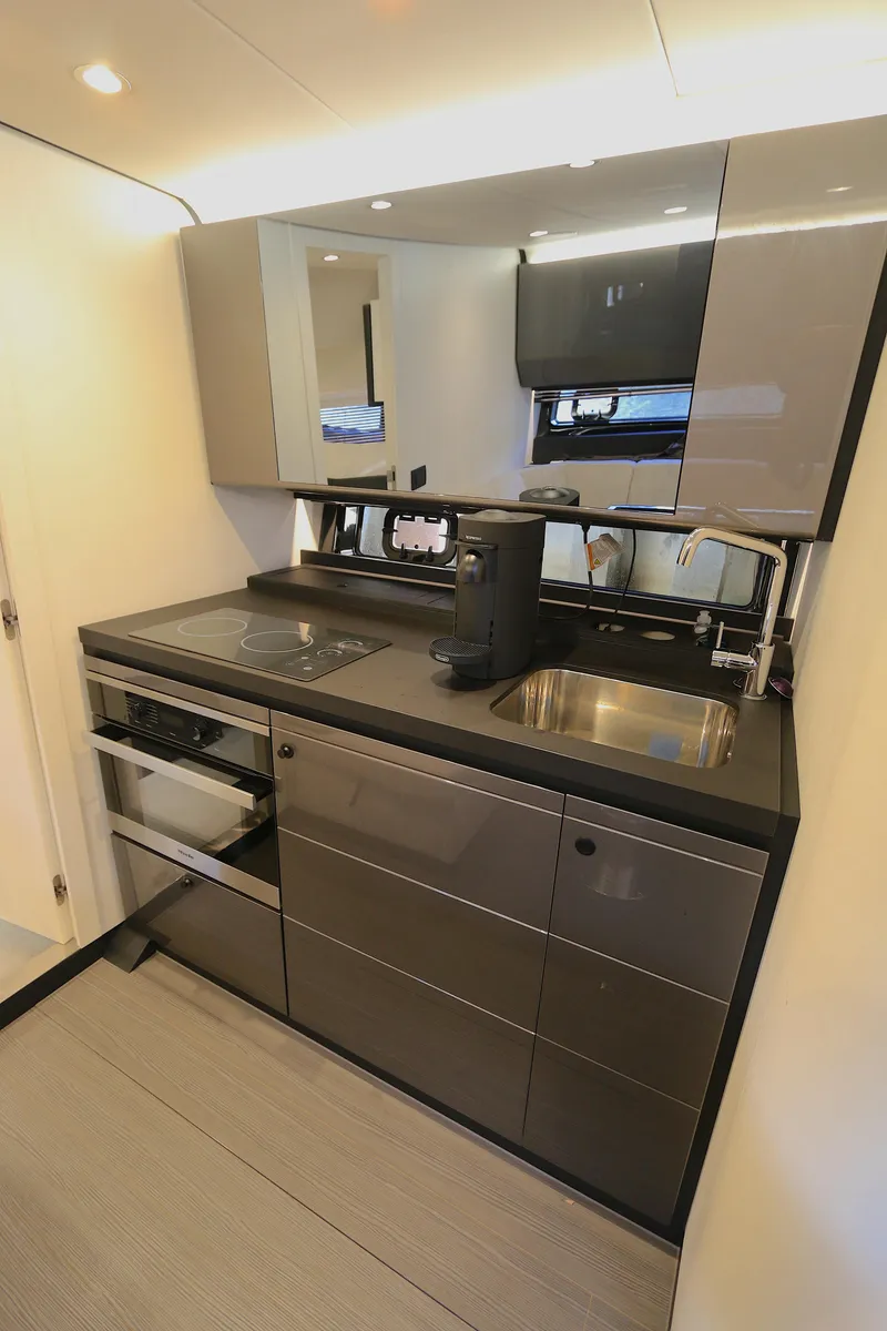 Slide: The Image of Modern kitchen interior of 2022 Azimut 47 VERVE yacht with sleek cabinetry and appliances. - 3