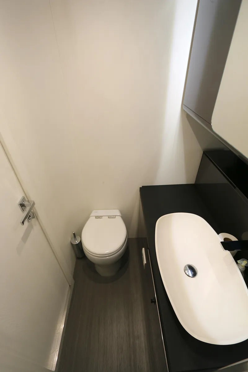 Slide: The Image of Modern bathroom interior in 2022 Azimut 47 VERVE yacht, featuring sleek sink and toilet. - 6