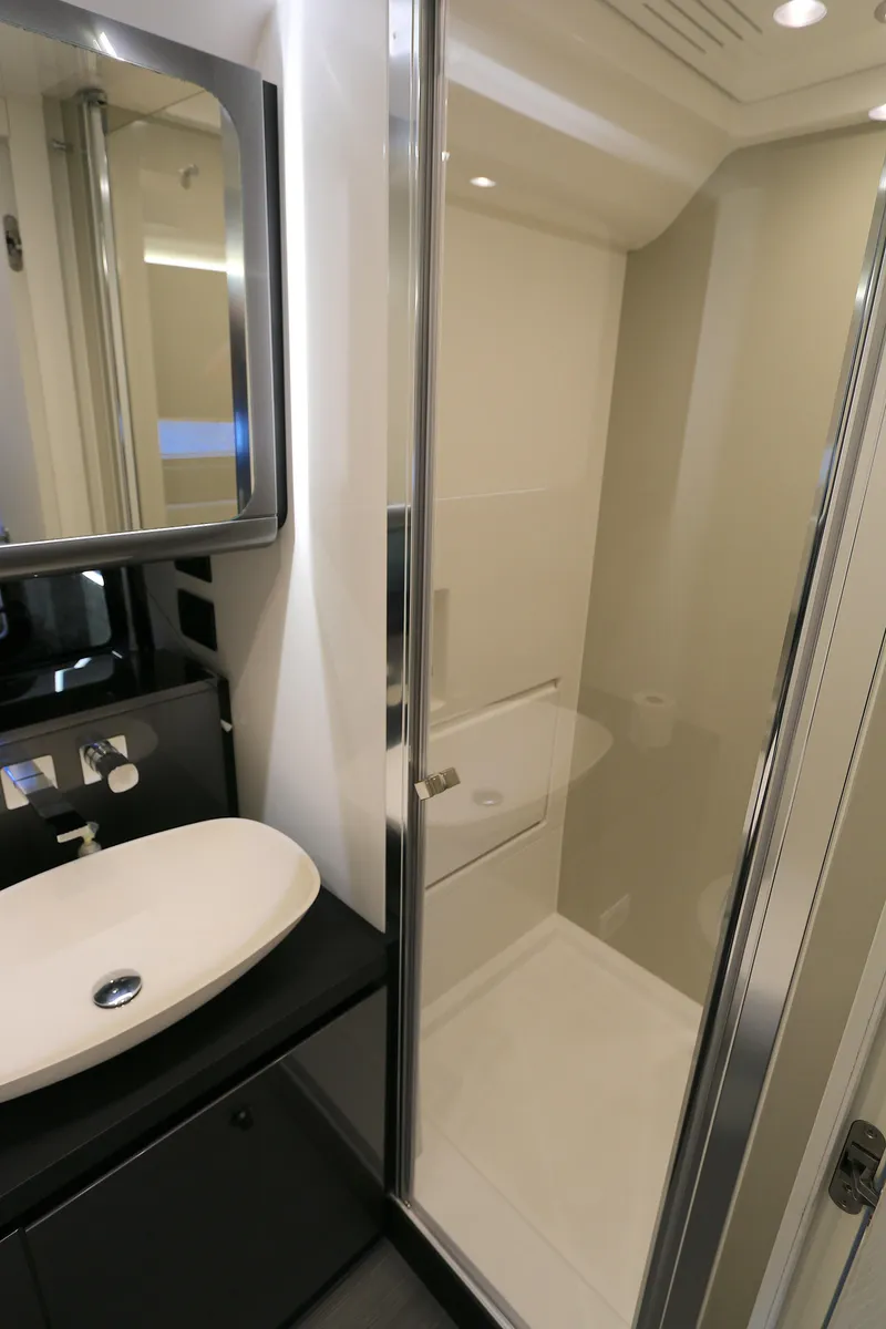 Slide: The Image of Luxurious bathroom in 2022 Azimut 47 VERVE yacht with modern shower and sleek sink design. - 7
