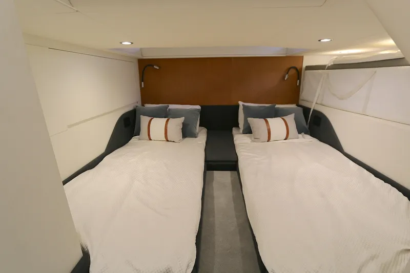 Slide: The Image of Interior cabin of 2022 Azimut 47 VERVE yacht with twin beds and modern decor. - 8
