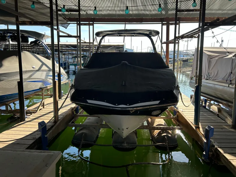 Slide: The Image of 2017 Scarab 255 boat docked in marina with protective cover. - 3