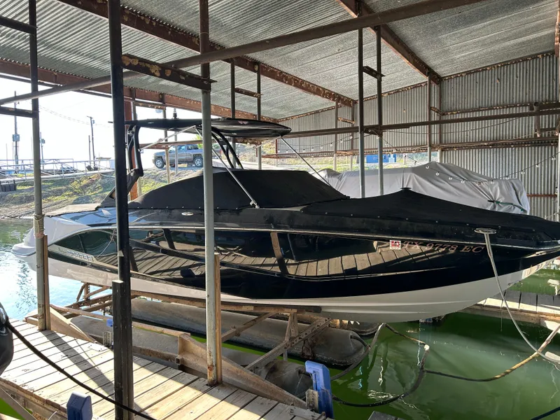 Slide: The Image of 2017 Scarab 255 boat docked in a covered marina. - 5