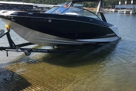 Slide: The Image of 2017 Scarab 255 boat on trailer at lakeside dock. - 7