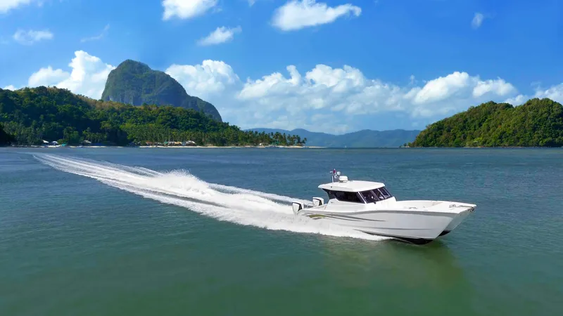 The Image of 2025 Custom SILVERCAT 34HT cruising on scenic tropical waters. - 0