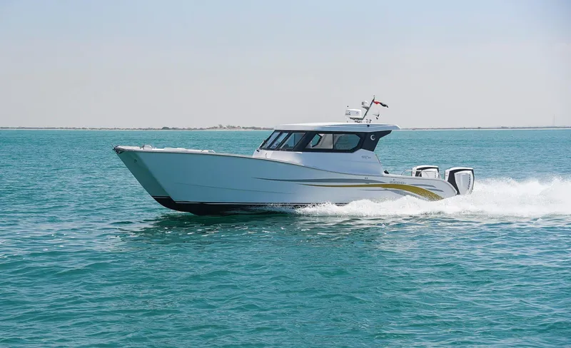 Slide: The Image of 2025 Custom SILVERCAT 34HT cruising on clear blue water. - 1