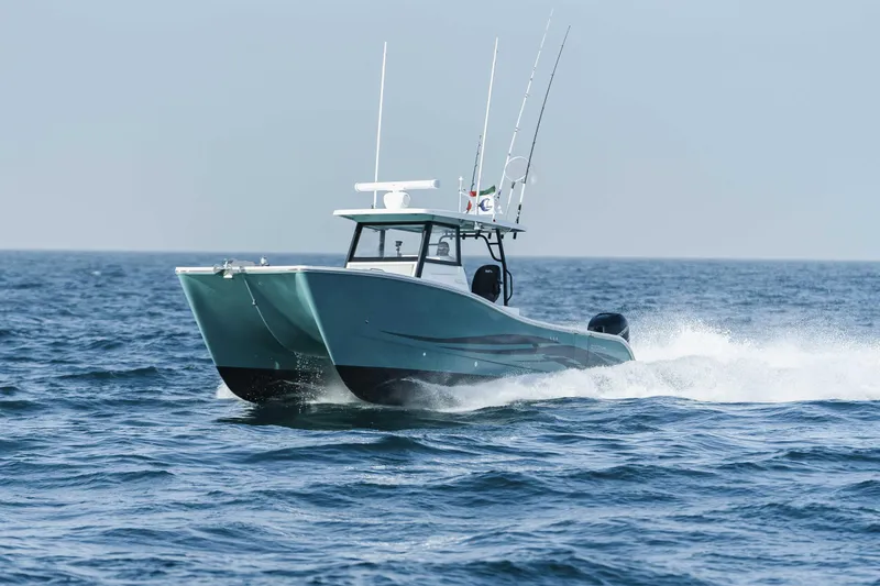 Slide: The Image of 2025 SilverCAT 34 CC catamaran cruising on open sea. - 10