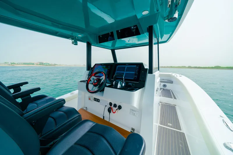 Slide: The Image of Interior view of 2025 SilverCAT 34 CC boat with modern dashboard and seating. - 3