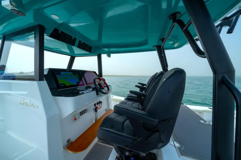 Slide: The Image of Interior view of 2025 SilverCAT 34 CC boat with modern helm and seating. - 5