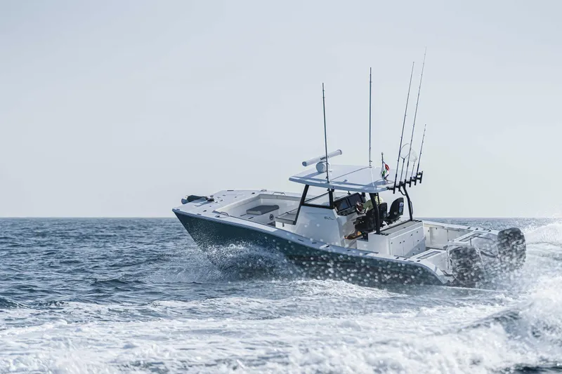 Slide: The Image of 2025 SilverCAT 34 CC boat cruising on open water, showcasing sleek design and powerful performance. - 13