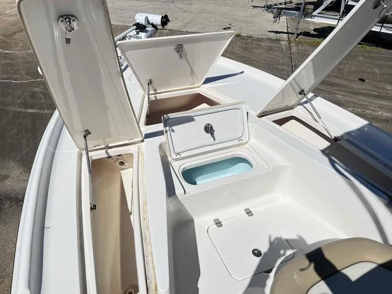 Slide: The Image of 2019 Key West 230 Bay Reef boat with open storage compartments. - 10