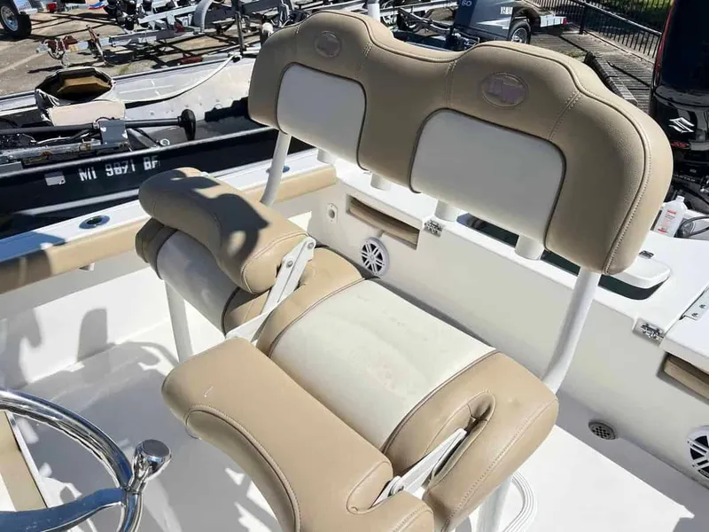 Slide: The Image of 2019 Key West 230 Bay Reef boat seating and console area. - 5