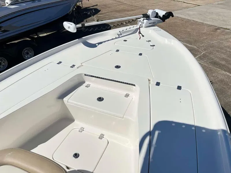 Slide: The Image of 2019 Key West 230 Bay Reef boat deck with storage compartments and trolling motor. - 7
