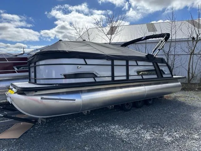 Slide: The Image of 2024 Starcraft EXS-3 Q pontoon boat with cover in outdoor storage. - 5