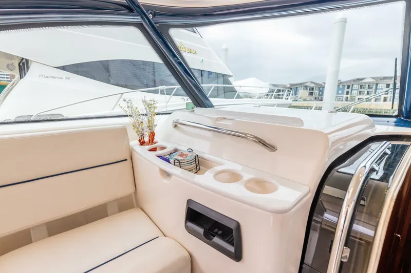 Slide: The Image of Interior of 2004 Tiara Yachts 38 Express with seating and cup holders. - 10